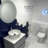 A modern and clean design bathroom with blue-white tiles that gives a classic ambience to ensures the comfort of our guests.
